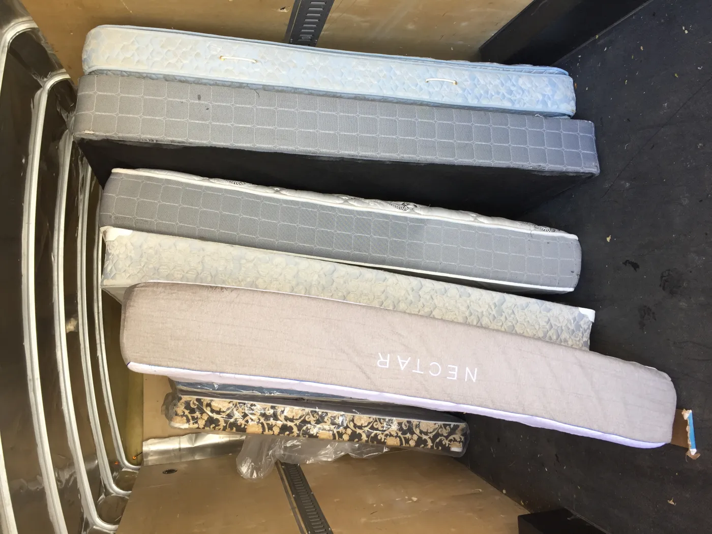 Mattresses loaded in a trailer for recycling