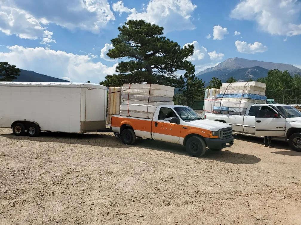 Recycling trucks loaded with mattresses