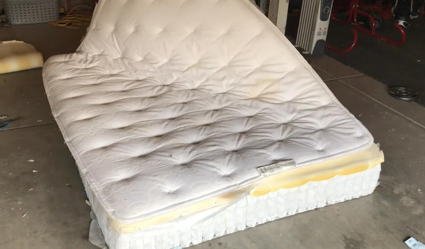 Tearing open a mattress to inspect what’s inside
