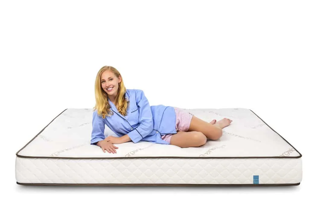 Mattress Insider latex mattress with a person reclining on its white cover